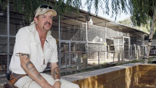 In this Aug. 28, 2013, file photo, Joseph Maldonado answers a question during an interview at the zoo he runs in Wynnewood, Okla. Federal prosecutors on Friday, Sept. 7, 2018, announced that the zookeeper, also known as "Joe Exotic," and candidate for governor earlier this year, has been charged in a murder-for-hire scheme alleging he tried to hire someone to kill a Florida woman. Prosecutors allege Maldonado-Passage tried to hire two separate people to kill the woman, who wasn't harmed. Maldonado-Passage finished third in a three-way Libertarian primary in June.