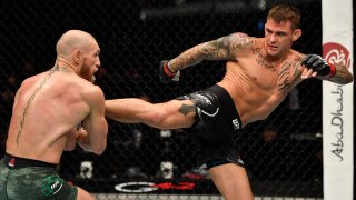 Dustin Poirier kicks Conor McGregor of Ireland in a lightweight fight during the UFC 257 event inside Etihad Arena on UFC Fight Island on January 23, 2021 in Abu Dhabi, United Arab Emirates.