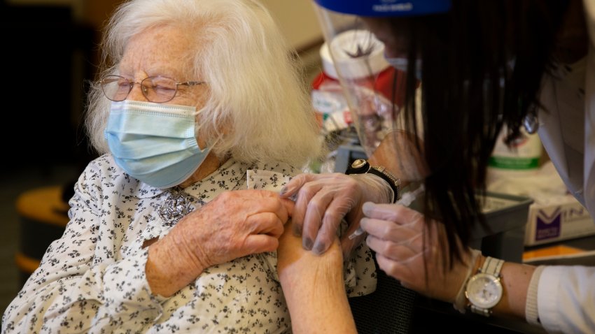 101-year-old Holocaust survivor Trudy Schwarz receives the second COVID-19 vaccine shot at the Orchard Cove senior living community in Canton.