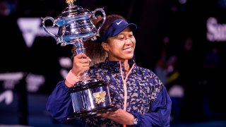 Naomi Osaka of Japan holds her trophy after winning the Women's Singles Final of the 2021 Australian Open on February 20 2021, at Melbourne Park in Melbourne, Australia.