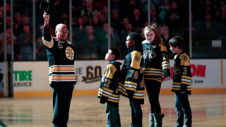 In this Jan. 17, 2018, file photo, Boston Bruins legend Willie O'Ree is honored before a game between the Bruins and the Montreal Canadiens at Boston's TD Garden.
