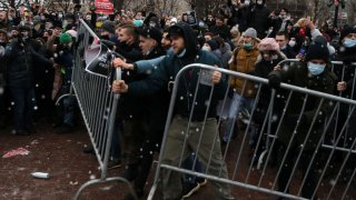 Participants of an unauthorized protest rally against of jailing of opposition leader Alexei Navalny clash with police, on Jan. 23, 2021 in Moscow, Russia.