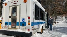 Lowell science teacher John King and the bus he now teaches from