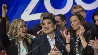 Eric Yuan, founder and chief executive officer of Zoom Video Communications Inc., center, reacts while ringing the opening bell during the company’s initial public offering (IPO) at the Nasdaq MarketSite in New York, U.S., on Thursday, April 18, 2019. Zoom reported net income of $7.6 million on revenue of $331 million for the year ended January, and is now worth nine times the $1 billion valuation it secured after a funding round two years ago.
