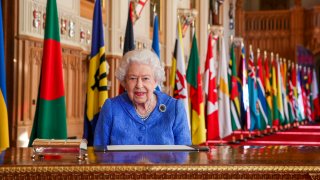 In this March 5, 2021, file photo, Britain's Queen Elizabeth II poses for a photo while signing her annual Commonwealth Day Message inside St George's Hall at Windsor Castle, England.