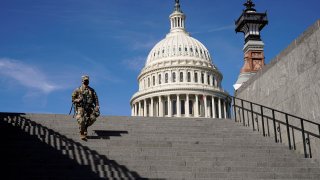 A member of the National Guard walks as the House of Representatives takes up debate of U.S. President Joe Biden’s $1.9 trillion COVID-19 relief plan on Capitol Hill in Washington, March 8, 2021.