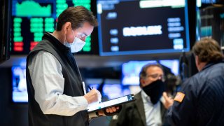 Traders work on the floor of the New York Stock Exchange.
