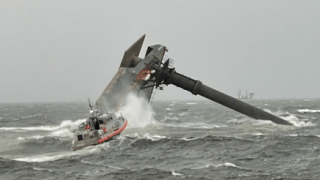 In this April 13, 2021, file photo, a commercial lift boat is seen capsized off the coast of Louisiana.