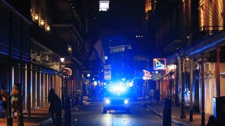 Members of the New Orleans Police Department help clear Bourbon Street on March 16, 2020.