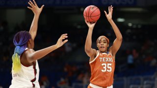 SAN ANTONIO, TX - MARCH 30: Charli Collier #35 of the Texas Longhorns shoots over Aliyah Boston #4 of the South Carolina Gamecocks in the Elite Eight round of the NCAA Women's Basketball Tournament at the Alamodome on March 30, 2021, in San Antonio, Texas.
