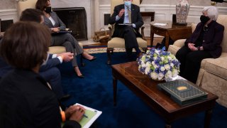 US President Joe Biden speaks as US Vice President Kamala Harris (center L), Janet Yellen (R), Secretary of the Treasury; Cecilia Rouse (L), Chair of the Council of Economic Advisers; and Brian Deese (2L), Director of the National Economic Council look on during the weekly economic briefing in the Oval office of the White House in Washington, DC, on April 9, 2021.