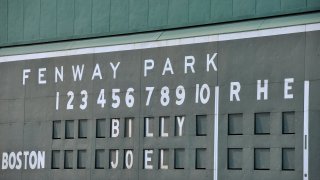 This file photo shows the scoreboard at Fenway Park showing Billy Joel's name.