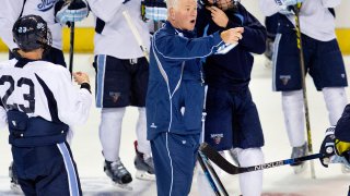 Red Gendron, coach of the UMaine men's hockey team, instructs his players in 2015