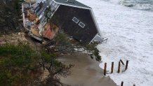 A damaged Sandwich, Mass. home following a coastal storm in February 2021