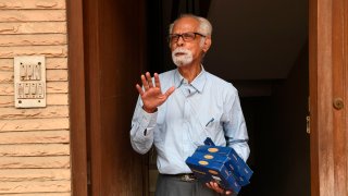 Uncle of US Democratic Vice President-Elect Kamala Harris, Balachandran Gopalan, gestures outside his home in New Delhi on November 8, 2020.