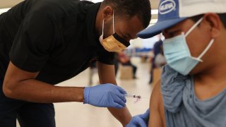 A person receiving the COVID-19 vaccine.