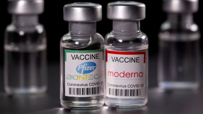 Vials with Pfizer-BioNTech and Moderna coronavirus disease (COVID-19) vaccine labels are seen in this illustration picture taken March 19, 2021.