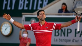 Serbia's Novak Djokovic reacts after winning a point against Stefanos Tsitsipas of Greece during their final match of the French Open tennis tournament