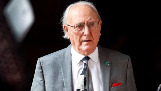 This May 23, 2019, file photo shows Boston Celtics legend Bob Cousy depart from the funeral of John Havlicek at Trinity Church in Boston's Copley Square.