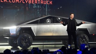 Tesla CEO Elon Musk unveils the Cybertruck at the TeslaDesign Studio in Hawthorne, Calif. The cracked window glass occurred during a demonstration on the strength of the glass.