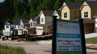 A sales center sign in front of a new residential community in Lithonia, Georgia, April 26, 2021.