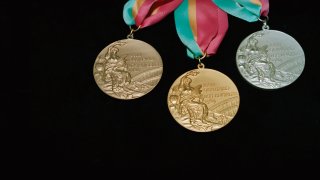 Gold, silver, and bronze Olympic medals from the 1984 Los Angeles Summer games.