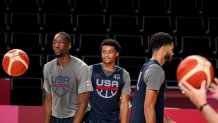 United States' Bam Adebayo, from left, Keldon Johnson, and Jayson Tatum, walk on the court