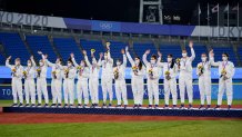 Silver medalist team United States celebrate on the podium during the medal ceremony for softball at the at the 2020 Summer Olympics, Tuesday, July 27, 2021, in Yokohama, Japan.