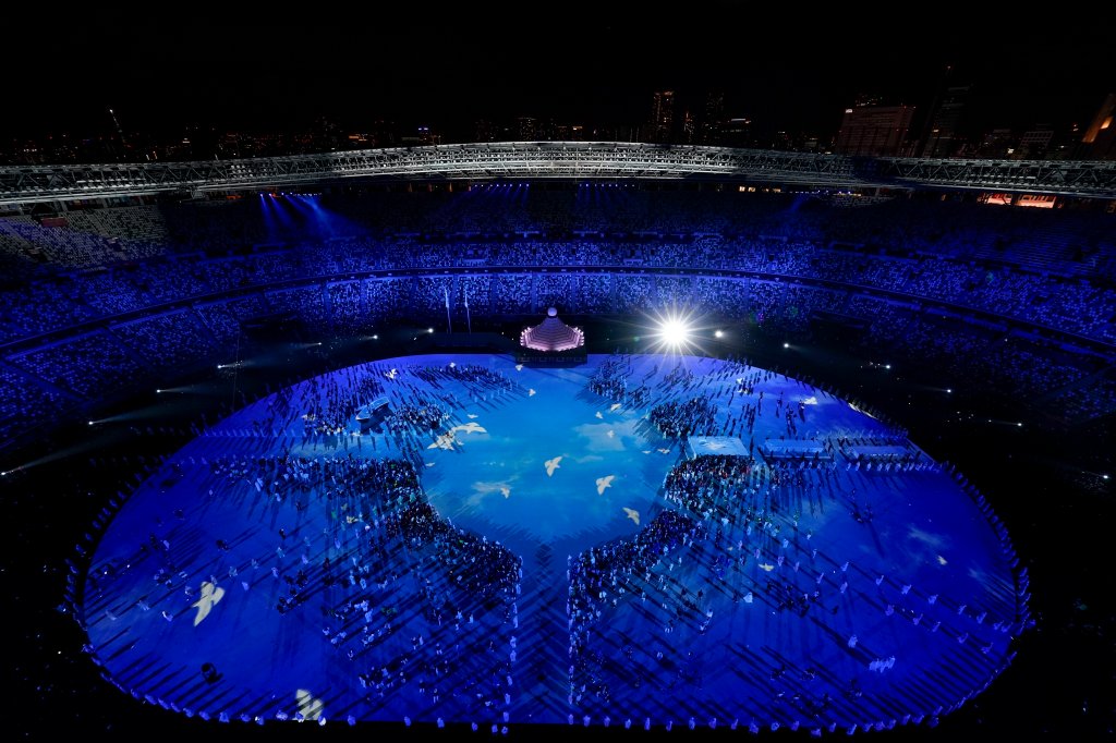 Doves are projected on the field during the opening ceremony at the Olympic Stadium at the 2020 Summer Olympics, Friday, July 23, 2021, in Tokyo.