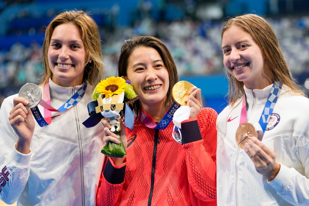 Gold medalist Yui Ohashi, centre, of Japan, stands with silver medalist Alex Walsh of the United States and bronze medalist Kate Douglass, right, of the United States, right, after the women's 200-meter individual medley final at the 2020 Summer Olympics, Wednesday, July 28, 2021, in Tokyo, Japan.