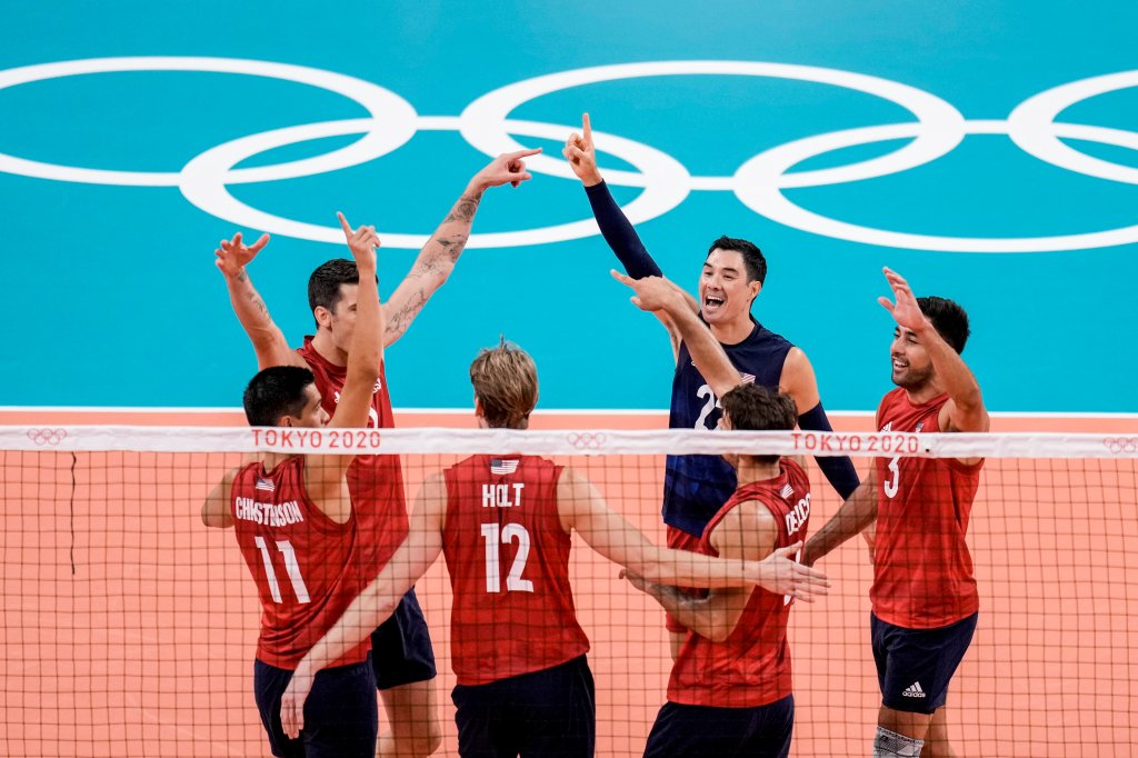 United States' team players celebrate a point during a men's volleyball preliminary round pool B match between United States and Tunisia at the 2020 Summer Olympics, Wednesday, July 28, 2021, in Tokyo, Japan.