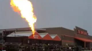 A controlled burn after a gas leak at the Home Depot in Auburn, Massachusetts, on July 13, 2021.