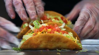 Tacos being made.