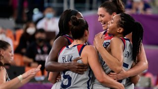 USA's teammates celebrate after wining at the end of the women's semi final 3x3 basketball match between US and France