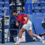 Serbia's Novak Djokovic smashes his racket during his Tokyo 2020 Olympic Games men's singles tennis match for the bronze medal against Spain's Pablo Carreno Busta at the Ariake Tennis Park in Tokyo on July 31, 2021.