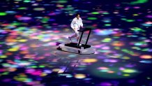Nurse and boxer Arisa Tsubata, symbolizing athletes training alone, yet still united in spirit, runs on a treadmill during the Opening Ceremony of the Tokyo 2020 Olympic Games at Olympic Stadium on July 23, 2021 in Tokyo, Japan.