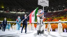 Flag bearers Haniyeh Rostamiyan and Mohammadsamad Nik Khahbahrami of Team Iran walk during the Opening Ceremony of the Tokyo 2020 Olympic Games at Olympic Stadium on July 23, 2021 in Tokyo, Japan. Each country have been asked to consider one female and one male flag bearer for the Parade of Nations to emphasize equality.