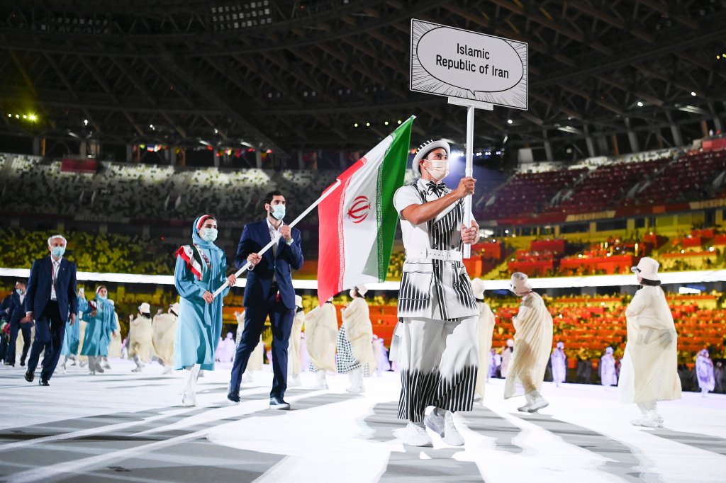 Flag bearers Haniyeh Rostamiyan and Mohammadsamad Nik Khahbahrami of Team Iran walk during the Opening Ceremony of the Tokyo 2020 Olympic Games at Olympic Stadium on July 23, 2021 in Tokyo, Japan. Each country have been asked to consider one female and one male flag bearer for the Parade of Nations to emphasize equality.