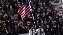 Flag bearers Sue Bird and Eddy Alvarez of Team United States lead their team out during the Opening Ceremony of the Tokyo 2020 Olympic Games at Olympic Stadium on July 23, 2021 in Tokyo, Japan.