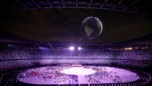 A drone display flies over the top of the stadium during the Opening Ceremony of the Tokyo 2020 Olympic Games at Olympic Stadium on July 23, 2021 in Tokyo, Japan.