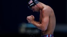 Michael Andrew of Team United States reacts after competing in the Men's 100m Breaststroke Final on day three of the Tokyo 2020 Olympic Games at Tokyo Aquatics Centre on July 26, 2021, in Tokyo, Japan.
