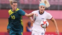 KASHIMA, JAPAN - JULY 27: Emily Van Egmond #10 of Team Australia battles for possession with Julie Ertz #8 of Team United States during the Women's Football Group G match between United States and Australia on day four of the Tokyo 2020 Olympic Games at Kashima Stadium on July 27, 2021 in Kashima, Ibaraki, Japan. (Photo by Atsushi Tomura/Getty Images)