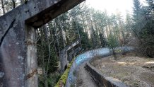 TO GO WITH STORY BY RUSMIR SMAJILHODZIC - A picture taken on February 5, 2014 shows Sarajevo's abandoned  Sarajevo's bob sleigh track near Sarajevo. Built and used as an Olympic venue during Sarajevo's 1984 Winter Olympic Games, the track was heavily damaged during Bosnia's 1992-95 war. It was never rebuilt and it's large concrete fragments remain standing as a memento of past and training ground for young generations of graffiti artists.  AFP PHOTO ELVIS BARUKCIC / AFP / ELVIS BARUKCIC        (Photo credit should read ELVIS BARUKCIC/AFP via Getty Images)