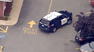 A Brockton police cruiser at a bank that was robbed Tuesday, July 6, 2021.