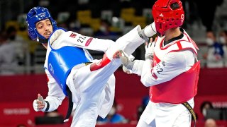 Vito Dell'Aquila lands a strike on Mohamed Khalil Jendoubi in the gold medal match.