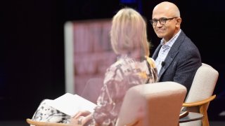 CEO of Microsoft Satya Nadella and Dean of USC Annenberg School for Communication and Journalism Willow Bay speak onstage during Vanity Fair New Establishment Summit at Wallis Annenberg Center for the Performing Arts on October 3, 2017 in Beverly Hills, California.