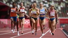 Netherlands' Sifan Hassan (2nd L) wins ahead of Australia's Jessica Hull (C) and USA's Elinor Purrier (R) the women's 1500m heats during the Tokyo 2020 Olympic Games at the Olympic Stadium in Tokyo on August 2, 2021.