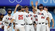Todd Frazier #25 of Team United States returns to the dugout after scoring in the sixth inning against South Korea during the semifinals of the men's baseball on day thirteen of the Tokyo 2020 Olympic Games at Yokohama Baseball Stadium on Aug. 5, 2021 in Yokohama, Japan.