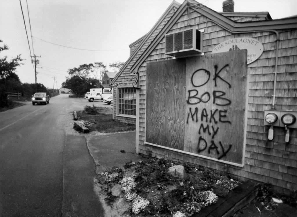 A board put up to protect a deli in Menemsha, Mass., on Martha's Vineyard, carries a challenge to the elements on Aug. 20, 1991, ahead of Hurricane Bob.