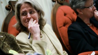 This April 7, 2009, file photo shows Beth Robinson, then on the Vermont Freedom to Marry Task Force, react as votes get close enough for a veto override for the same sex civil marriage law at Vermont's State House in Montpelier.